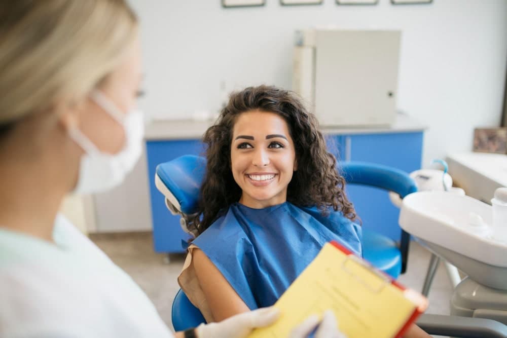 East River Dental dentist discussing cosmetic treatment options with a patient in Newmarket