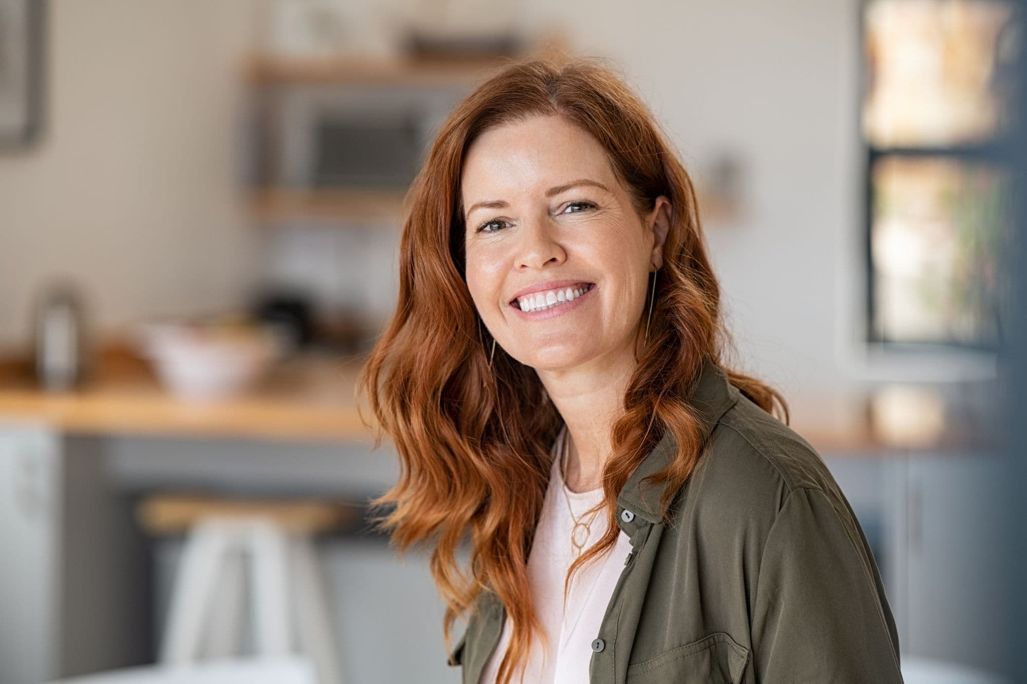 Patient smiling, representing oral exams and cleanings at East River Dental